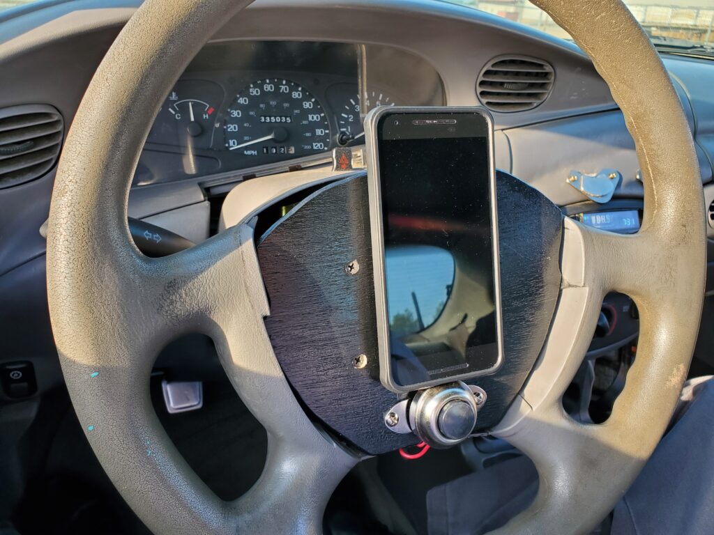 Phone mounted on steering wheel.
